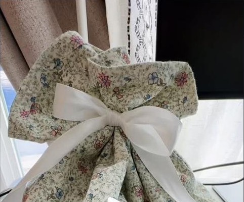 Floral fabric gift bag tied with a ribbon